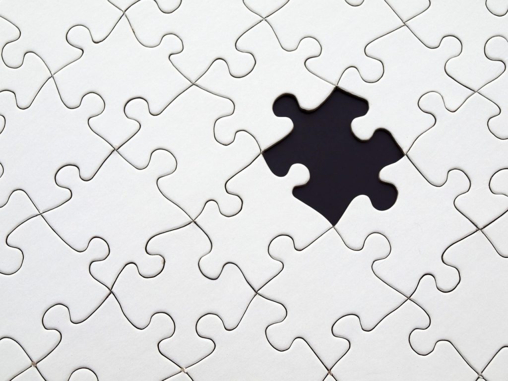 Puzzle with a missing piece to signify the difficulties of finding a missing person.