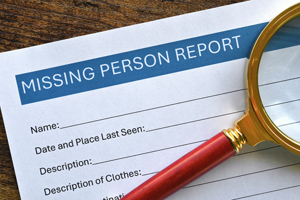 Investigative Services for Non-criminal Missing Persons report with magnifying glass.